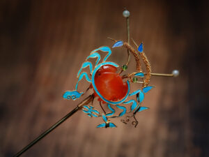 hairpin decorated with a gold filigree crab
